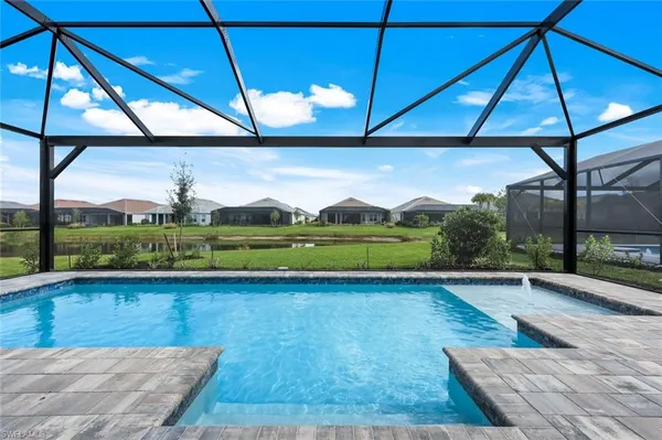 a view of a indoor swimming pool and a yard