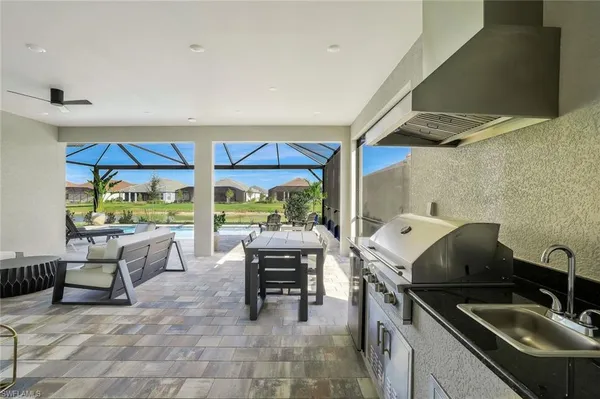 a living room with furniture a rug and a flat screen tv