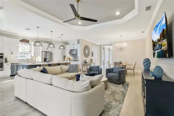 a living room with fireplace furniture and a flat screen tv