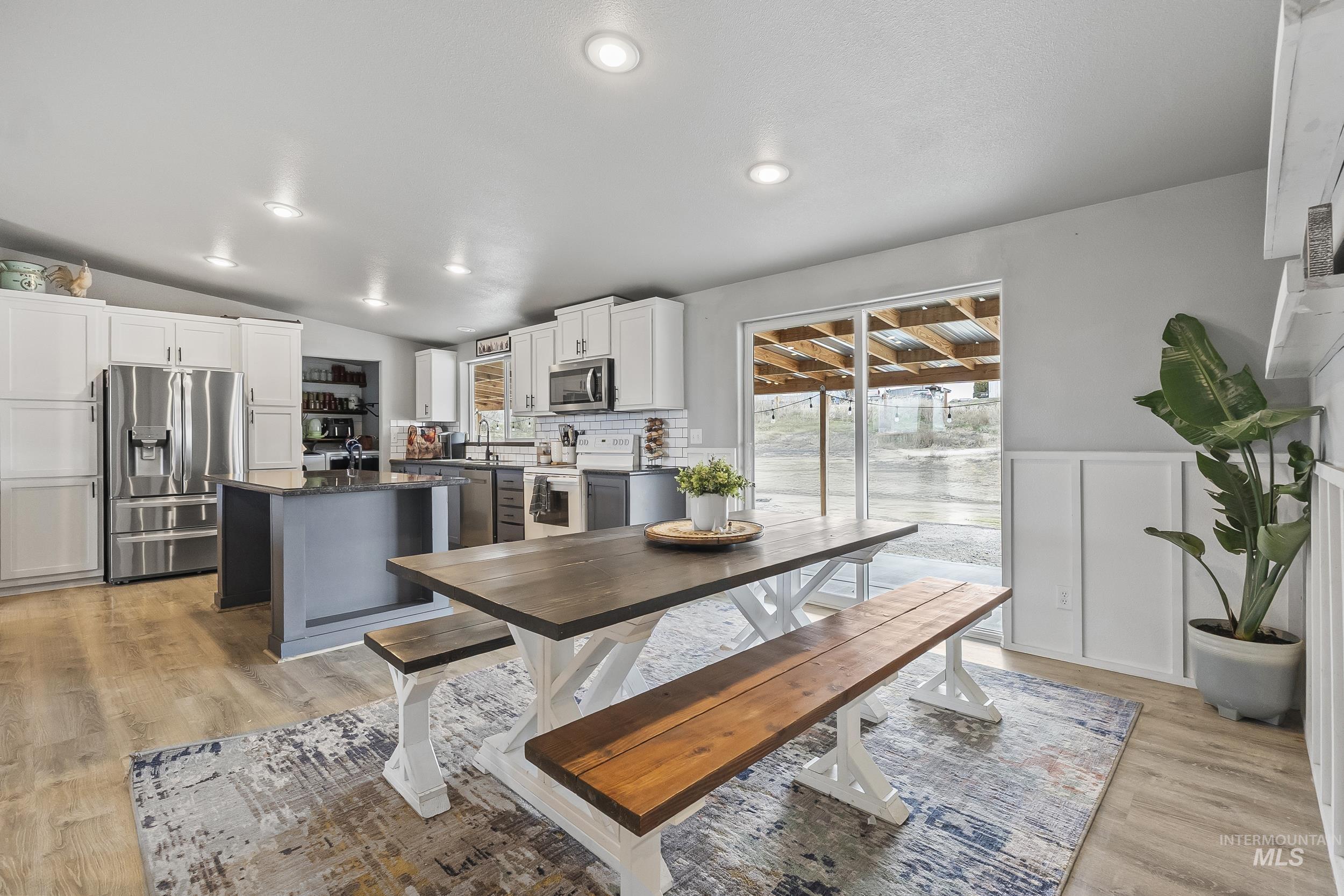 12944 Goodson Road Caldwell, ID 83607 - Photo 15 of 47 Dining space with light wood-type flooring, vaulted ceiling, and recessed lighting