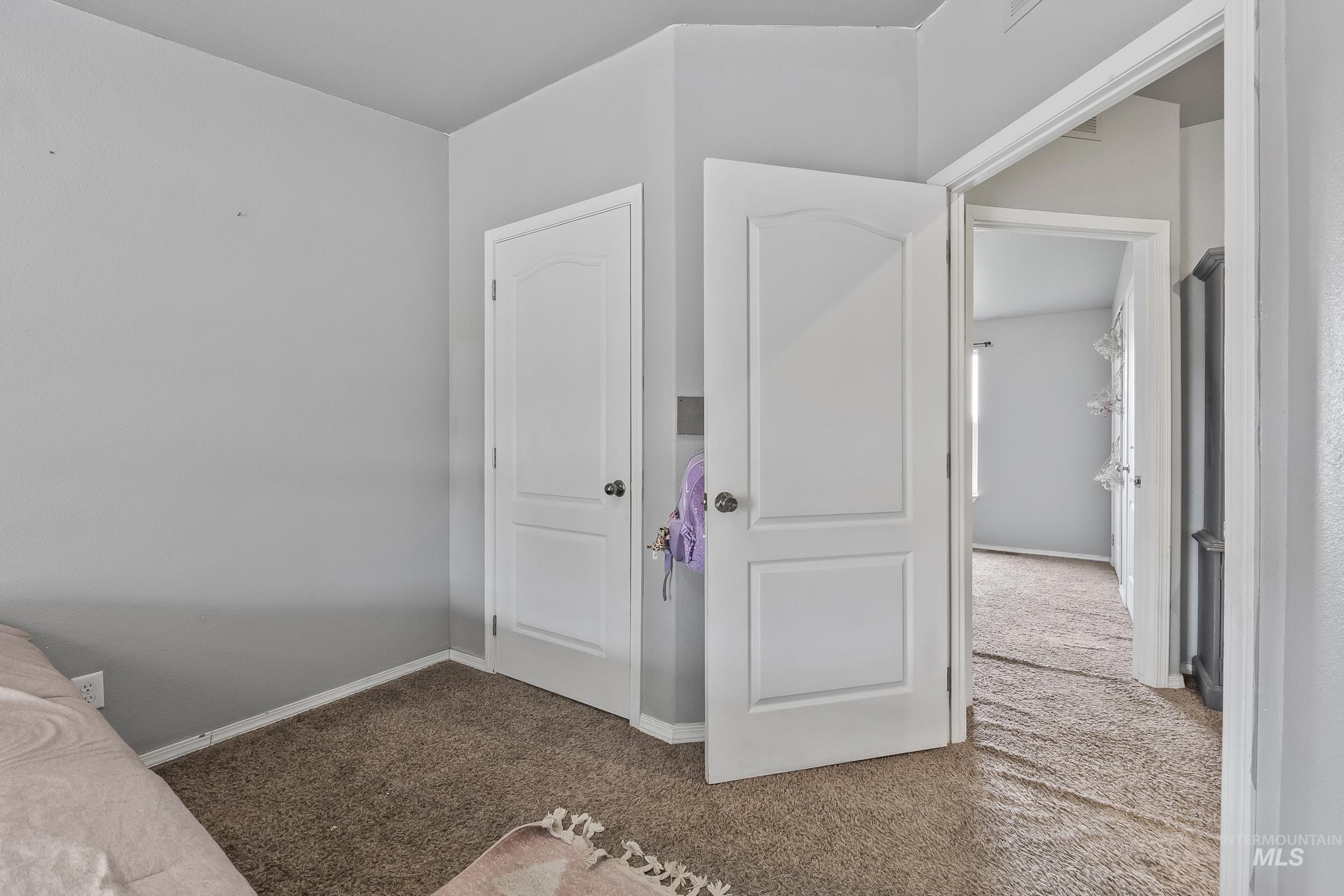12944 Goodson Road Caldwell, ID 83607 - Photo 23 of 47 Unfurnished bedroom with light colored carpet