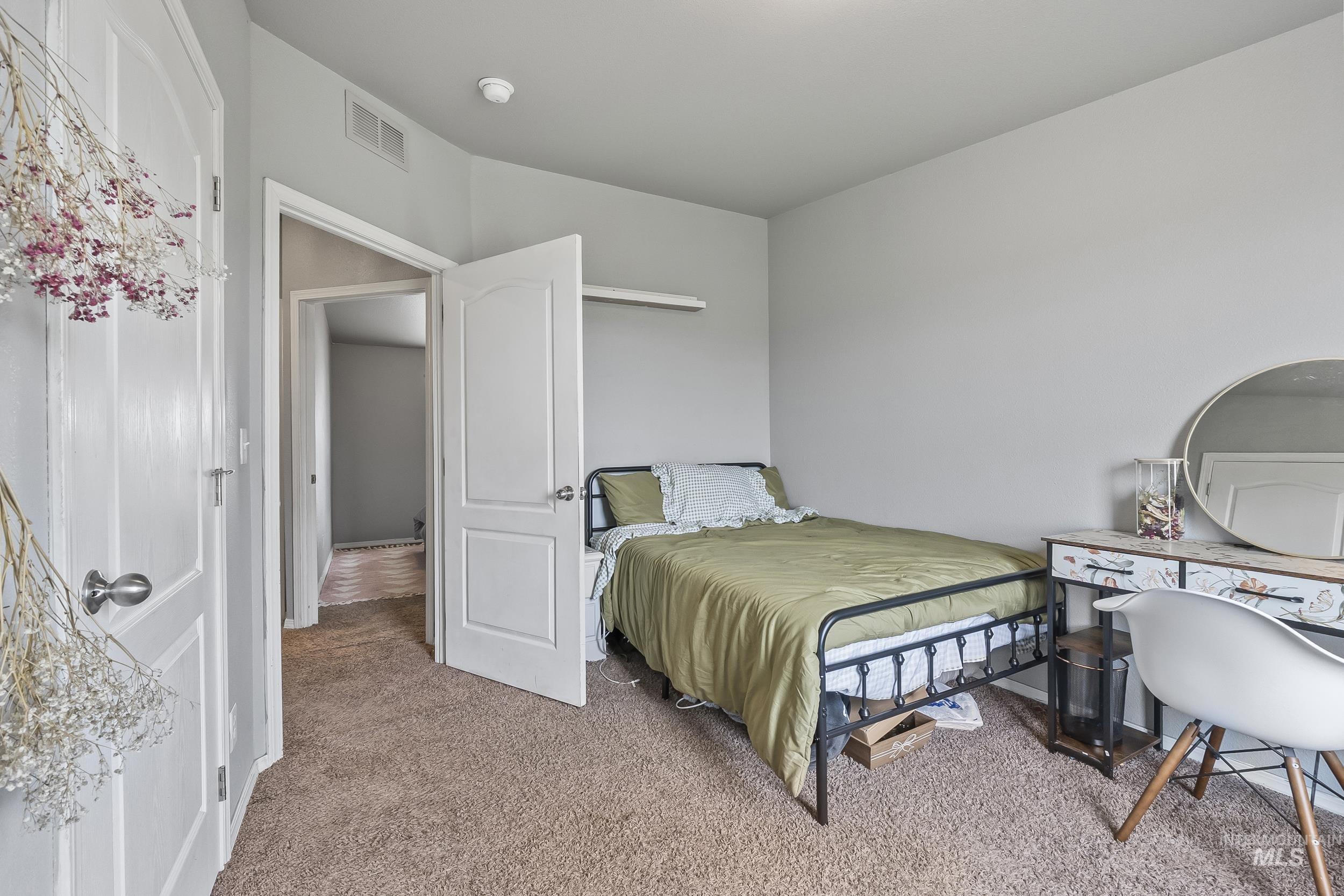 12944 Goodson Road Caldwell, ID 83607 - Photo 26 of 47 Bedroom featuring light colored carpet
