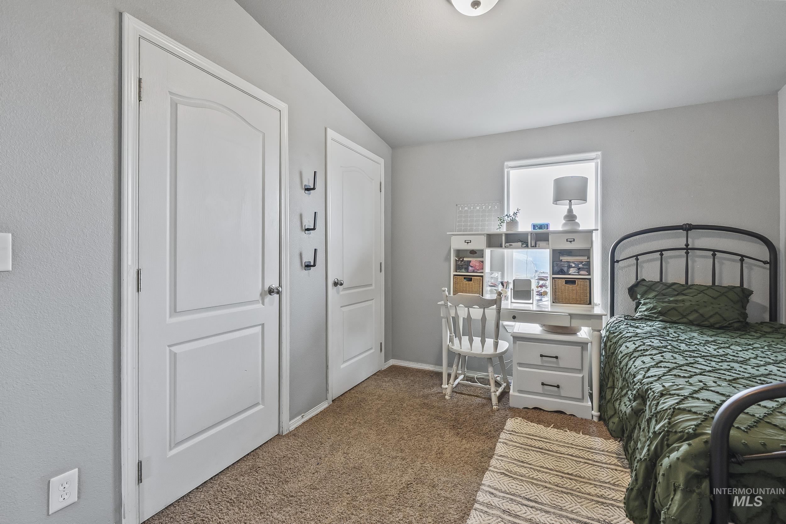 12944 Goodson Road Caldwell, ID 83607 - Photo 28 of 47 Bedroom featuring carpet and baseboards