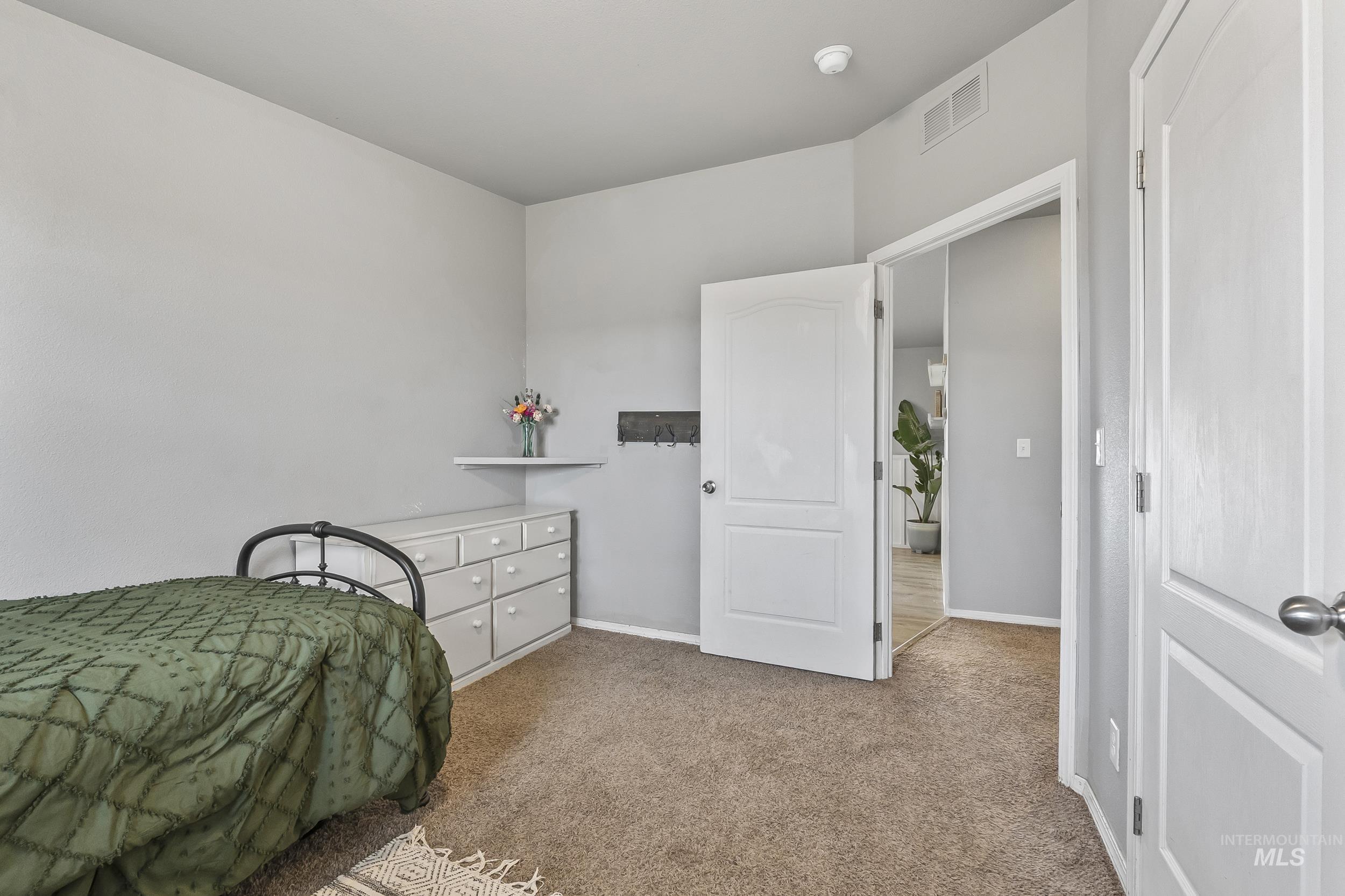 12944 Goodson Road Caldwell, ID 83607 - Photo 29 of 47 Bedroom featuring carpet floors and baseboards