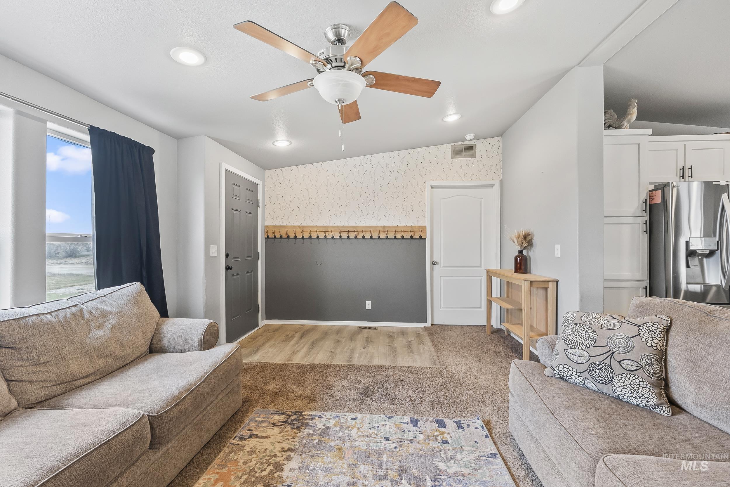 12944 Goodson Road Caldwell, ID 83607 - Photo 8 of 47 Living room featuring wallpapered walls, ceiling fan, light colored carpet, and recessed lighting