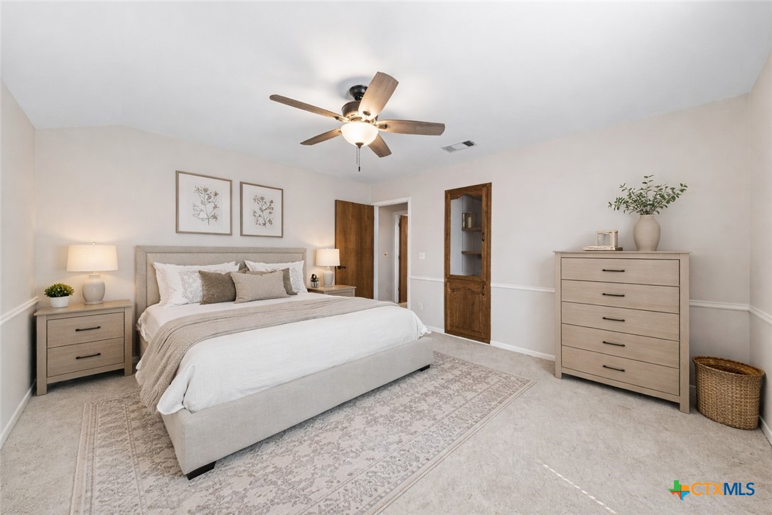 1903 North Harding Avenue Cameron, TX 76520 - Photo 29 of 44 a spacious bedroom with a bed and a dresser