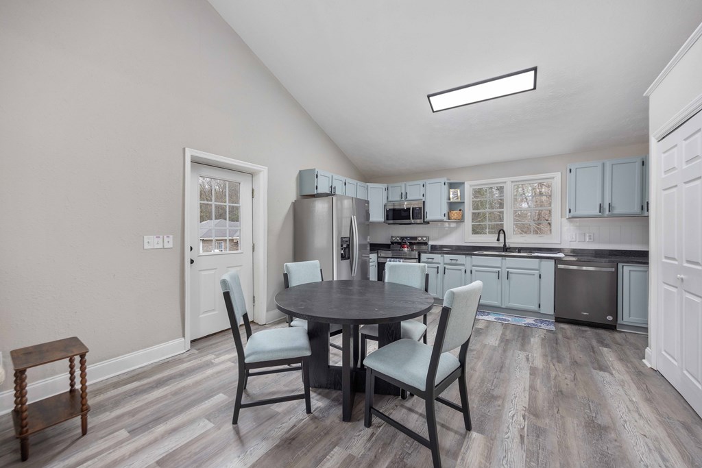 6703 Aldora Drive Columbus, GA 31907 - Photo 13 of 25 a view of a dining room with furniture and wooden floor