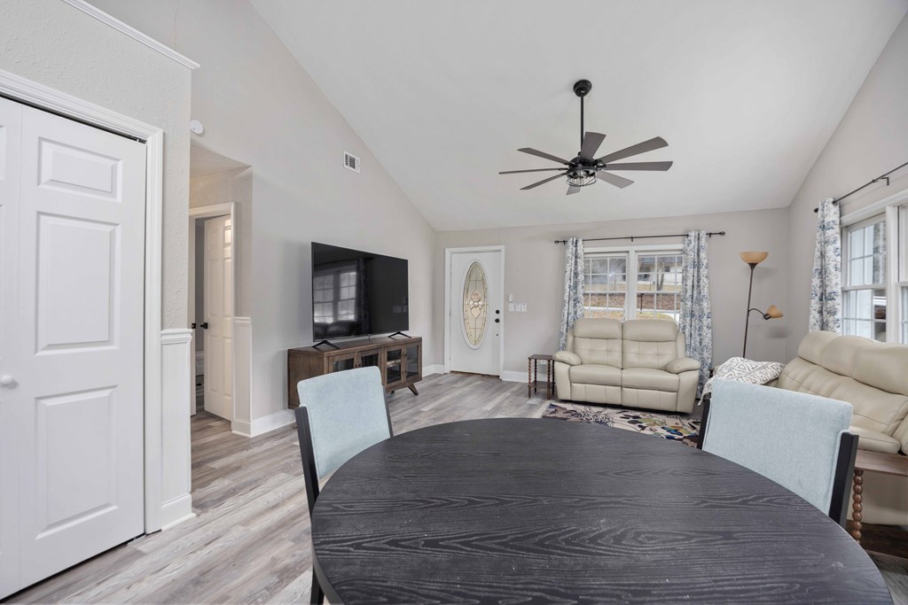 6703 Aldora Drive Columbus, GA 31907 - Photo 17 of 25 a living room with furniture a ceiling fan a flat screen tv and a window