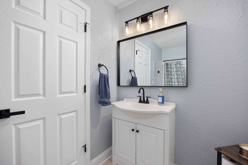 6703 Aldora Drive Columbus, GA 31907 - Photo 22 of 25 a bathroom with a sink and a mirror