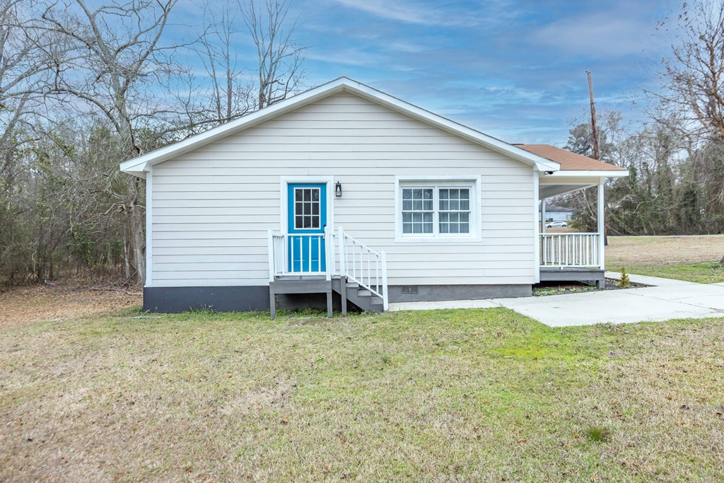 6703 Aldora Drive Columbus, GA 31907 - Photo 5 of 25 a view of a house with a yard and a garage