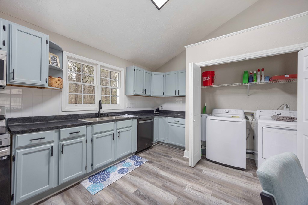 6703 Aldora Drive Columbus, GA 31907 - Photo 7 of 25 a kitchen with a sink stove and cabinets