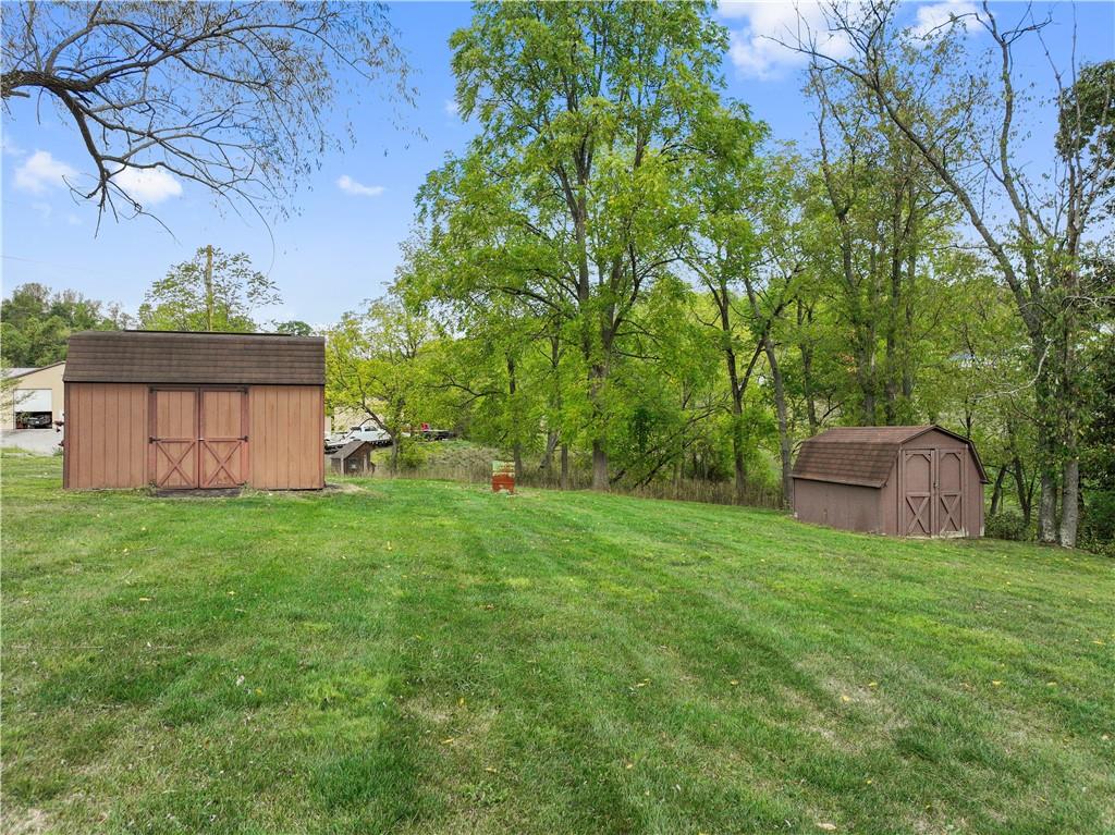 499 Old Post Road Prosperity, PA 15329 - Photo 8 of 45 a view of a backyard with potted plants and large trees