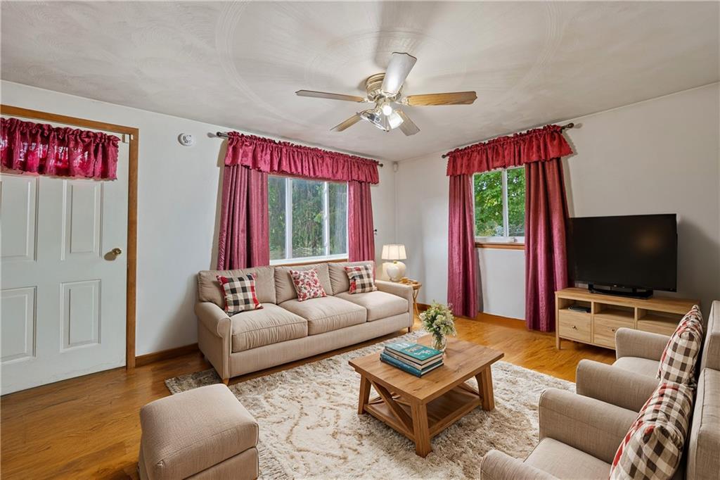 499 Old Post Road Prosperity, PA 15329 - Photo 10 of 45 a living room with furniture and a flat screen tv