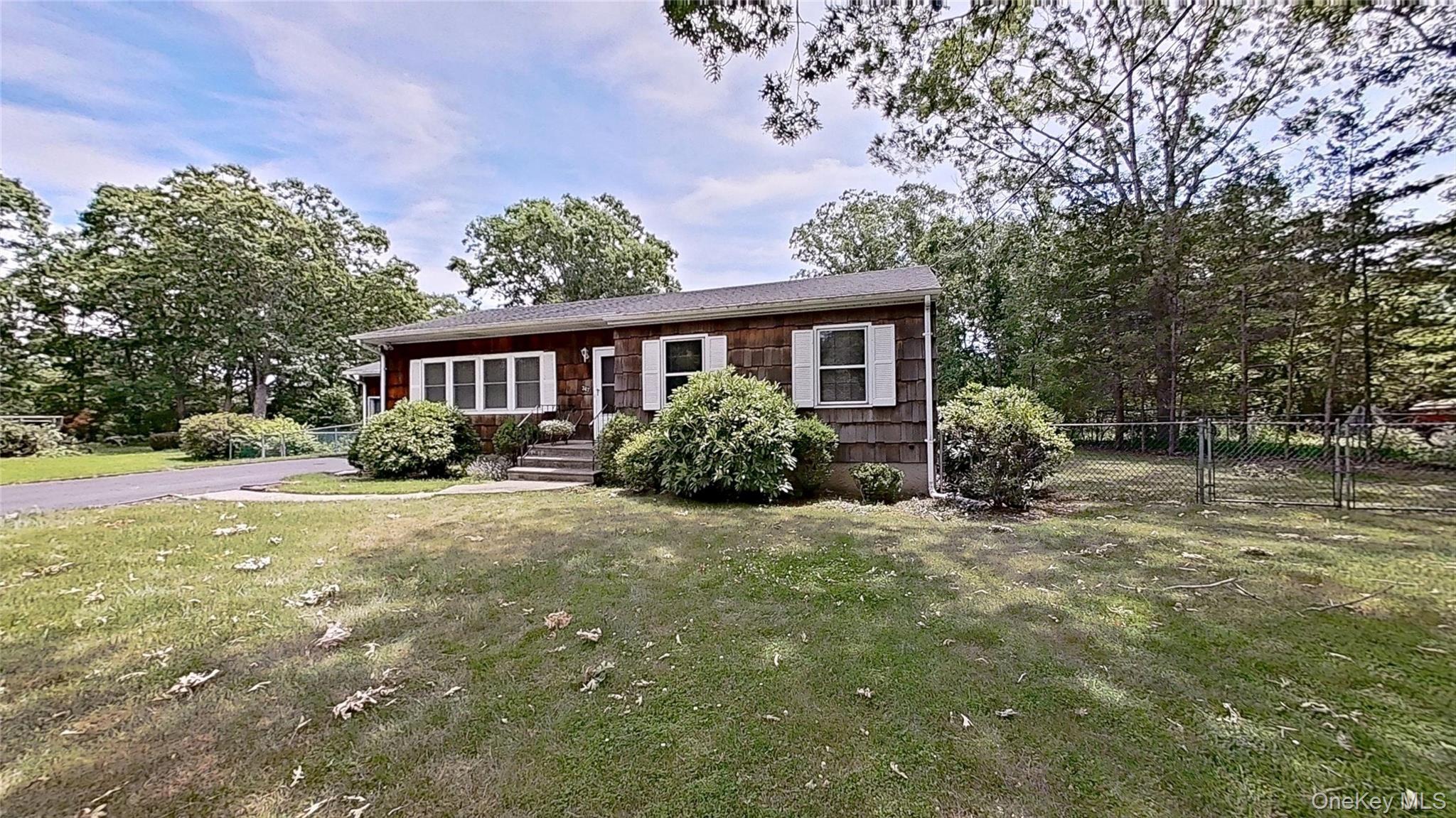 347 Miller Place Road Miller Place, NY 11764 - Photo 2 of 29 Setback off the road and featuring a fenced backyard!