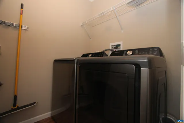 a view of storage and utility room with racks on the wall