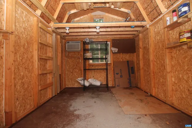 a view of a room with wooden walls