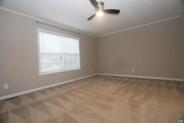 an empty room with a empty space and windows