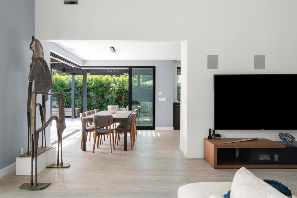 2807 Caminito Turnberry La Jolla, CA 92037 - Photo 19 of 50 a living room with furniture a flat screen tv and a large window