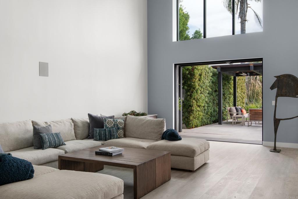 2807 Caminito Turnberry La Jolla, CA 92037 - Photo 24 of 50 a living room with furniture and a floor to ceiling window