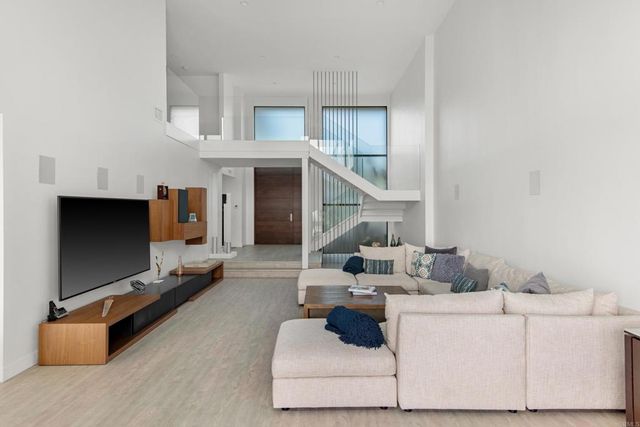 a bathroom with a sink a toilet a shower and a mirror