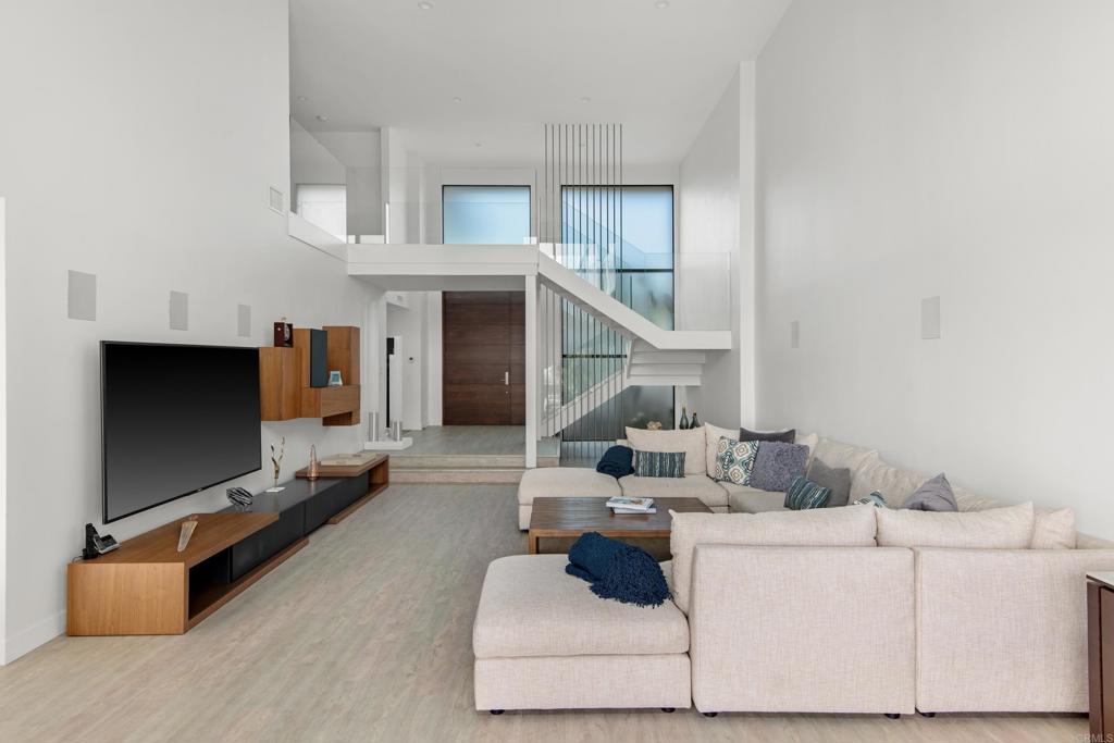2807 Caminito Turnberry La Jolla, CA 92037 - Photo 25 of 50 a living room with furniture and a flat screen tv