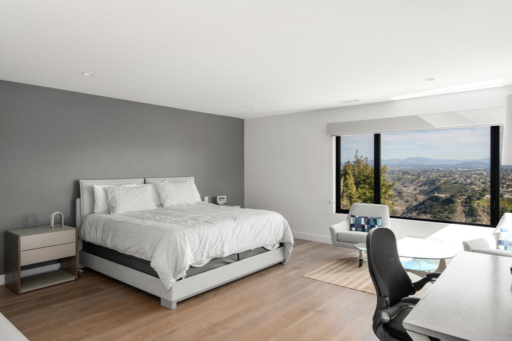 2807 Caminito Turnberry La Jolla, CA 92037 - Photo 32 of 50 a bedroom with a bed chair and a window