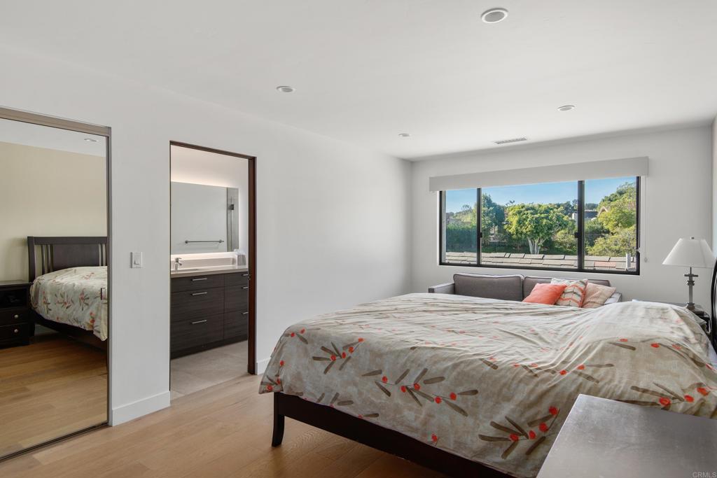 2807 Caminito Turnberry La Jolla, CA 92037 - Photo 38 of 50 a bedroom with a bed and a window