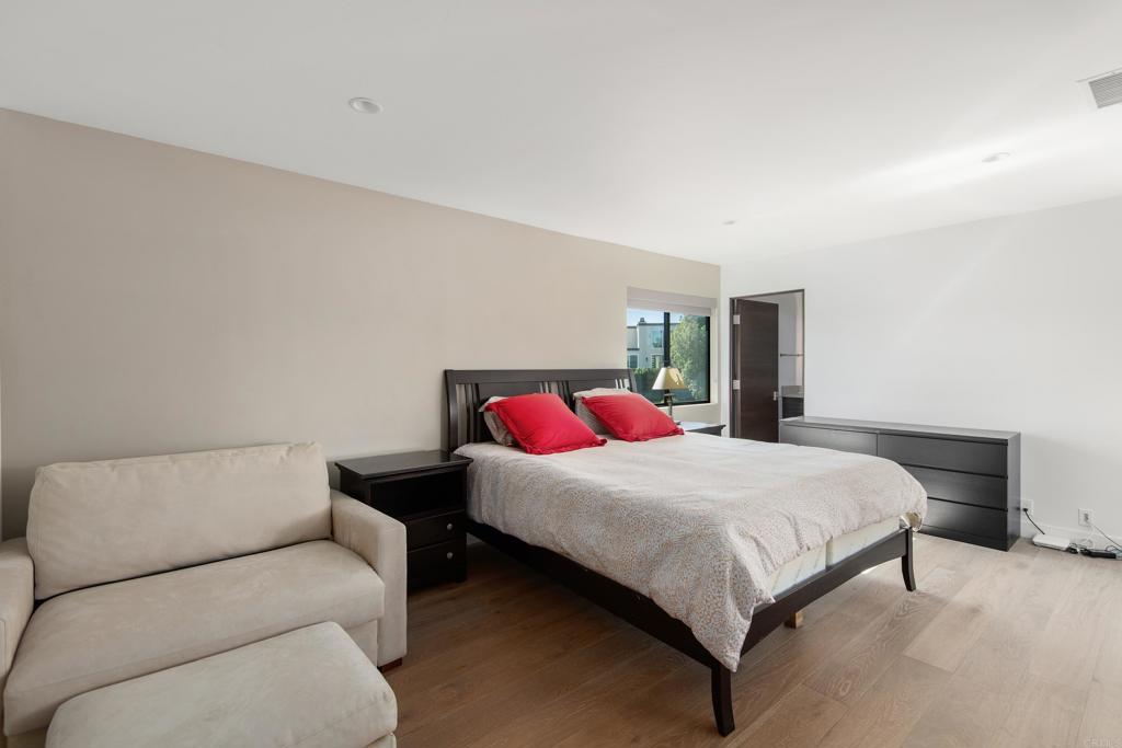 2807 Caminito Turnberry La Jolla, CA 92037 - Photo 40 of 50 a bedroom with a bed and window
