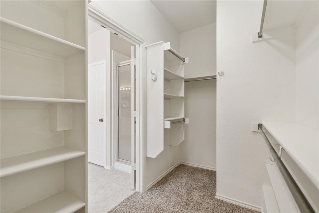 10937 Colonel Winn Loop Austin, TX 78748 - Photo 13 of 36 a bathroom with a shower and a glass door