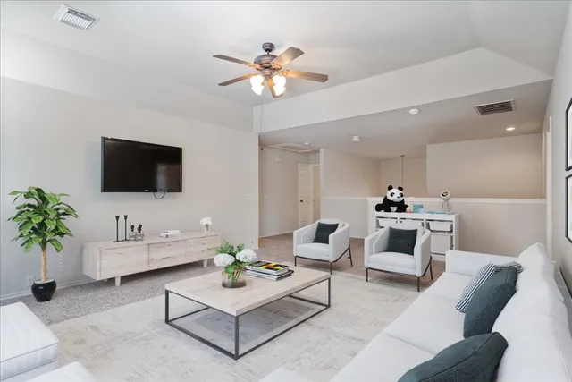 a view of an empty room with a flat screen tv