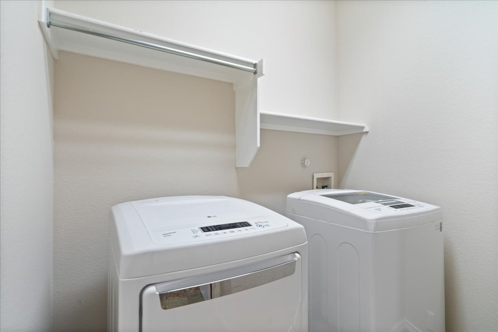 10937 Colonel Winn Loop Austin, TX 78748 - Photo 31 of 36 a utility room with dryer and washer