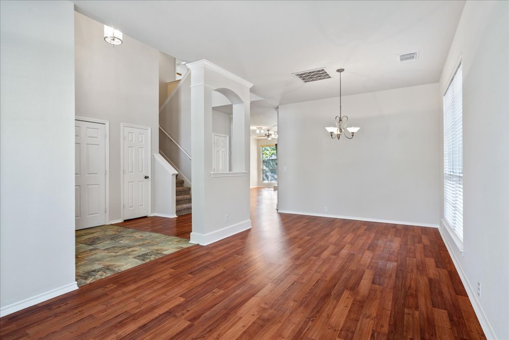 10937 Colonel Winn Loop Austin, TX 78748 - Photo 4 of 36 a view of empty room with wooden floor