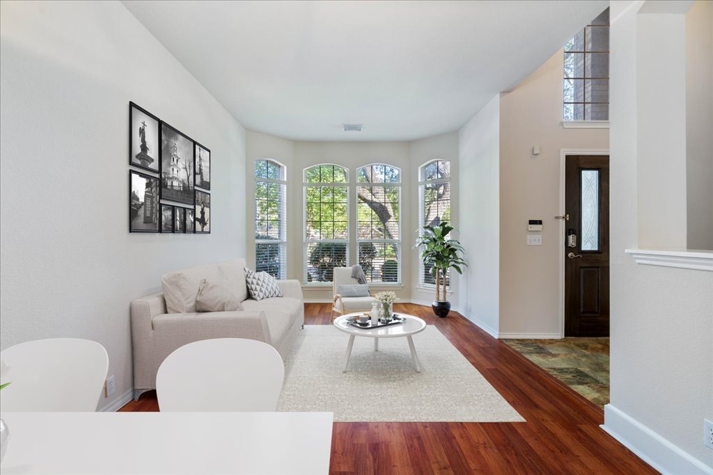 10937 Colonel Winn Loop Austin, TX 78748 - Photo 7 of 36 a living room with furniture and a large window