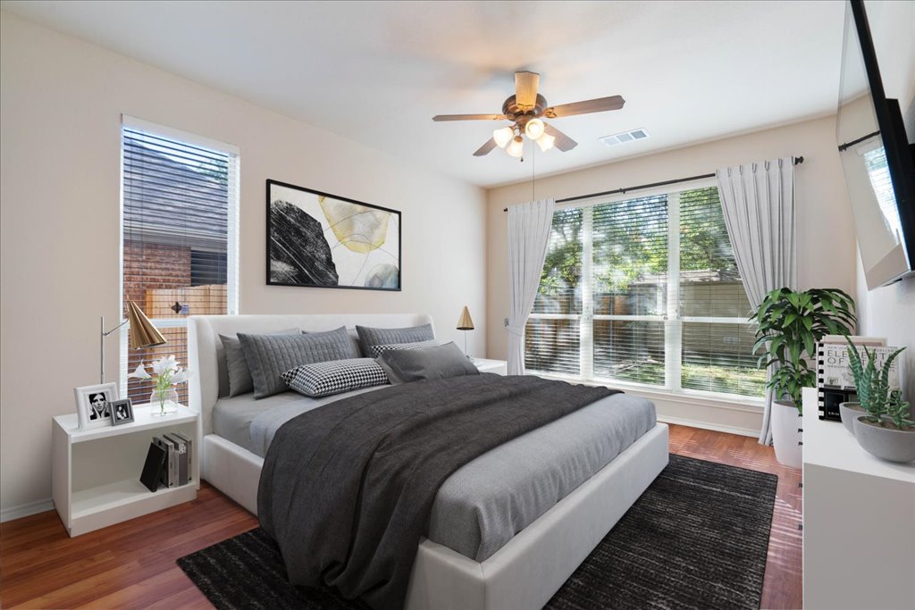 10937 Colonel Winn Loop Austin, TX 78748 - Photo 9 of 36 a bedroom with a large bed and a potted plant