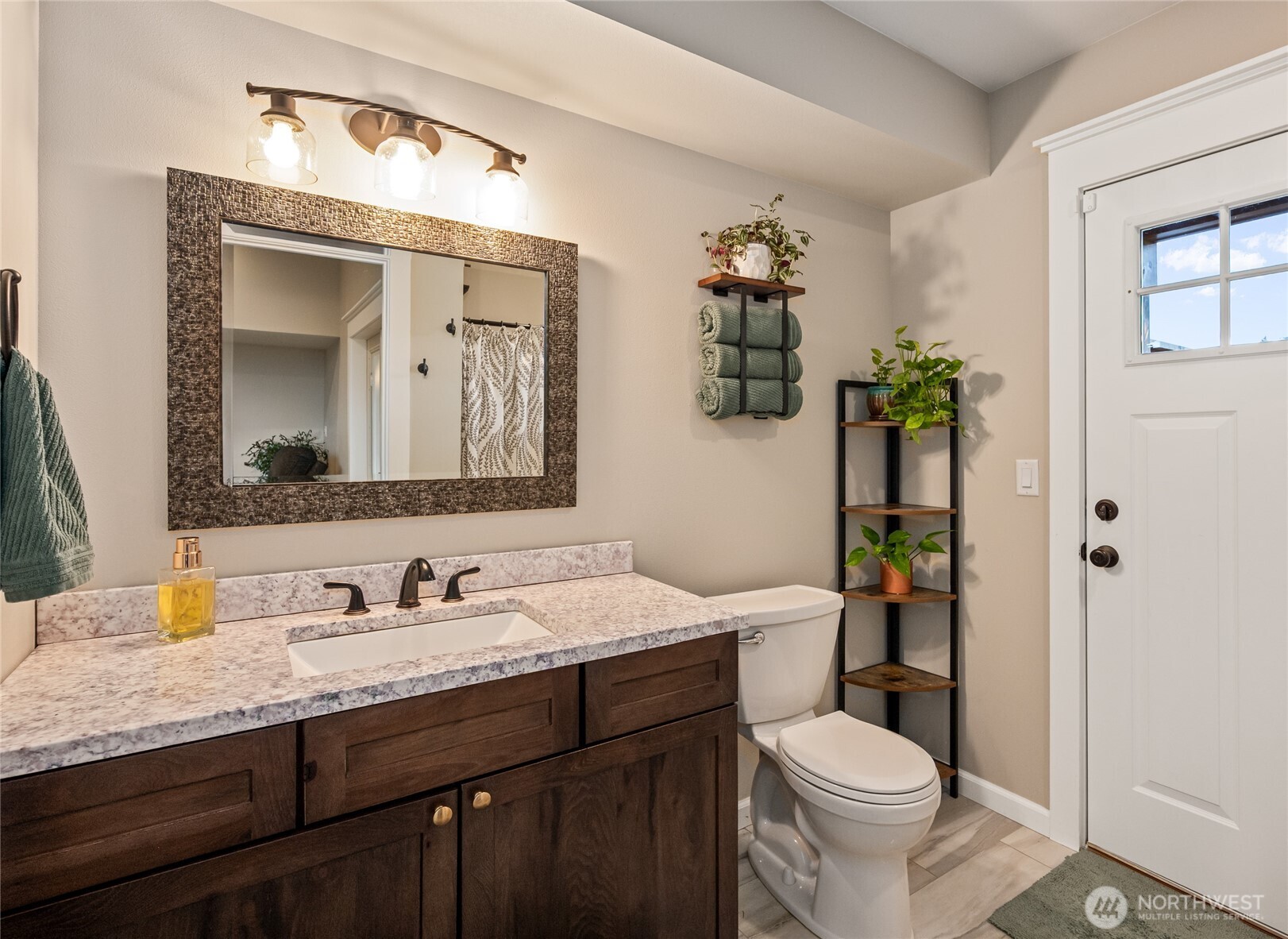 1726 63rd Street Southeast Everett, WA 98203 - Photo 19 of 37 a bathroom with a granite countertop toilet sink and mirror