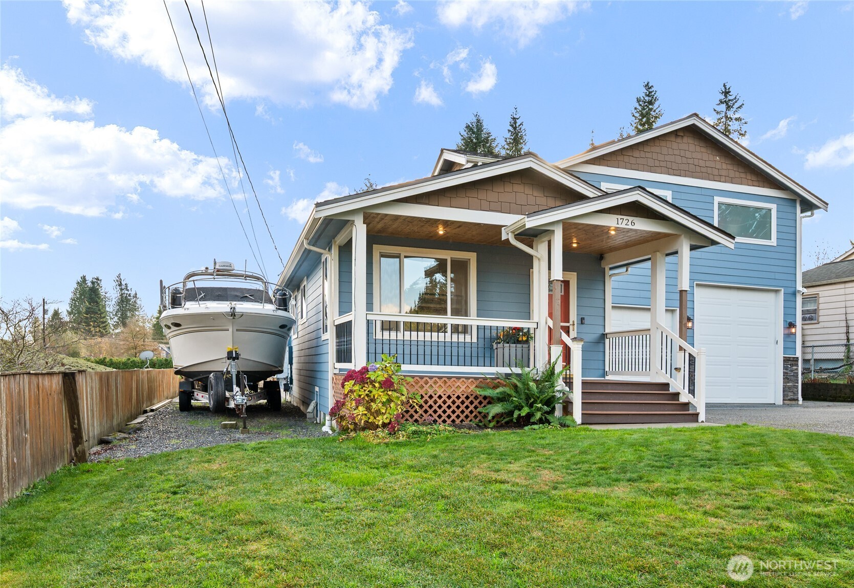 1726 63rd Street Southeast Everett, WA 98203 - Photo 35 of 37 a front view of a house with a garden