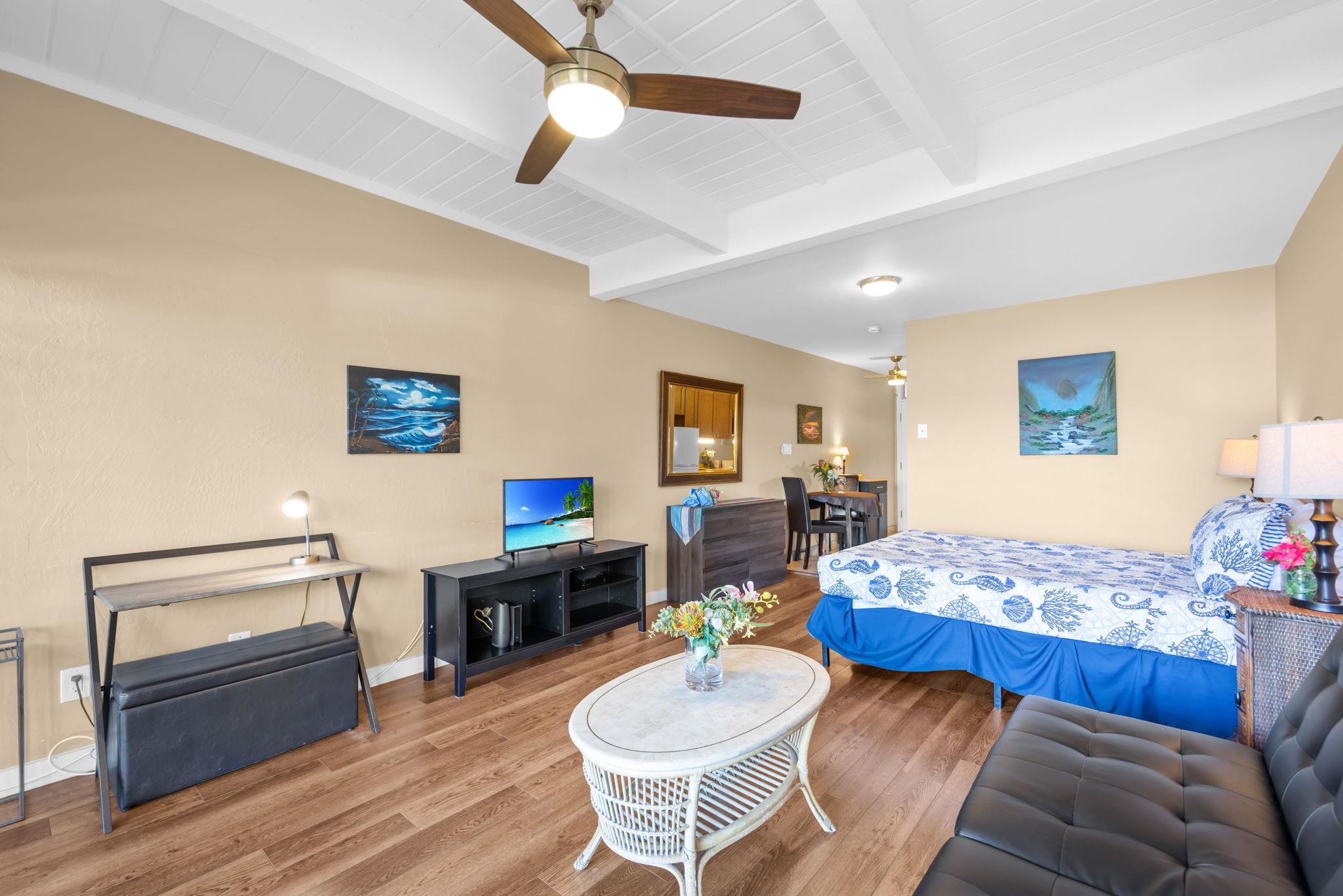 715 South Kihei Road, Unit 106 Kihei, HI 96753 - Photo 8 of 28 a living room with furniture and wooden floor