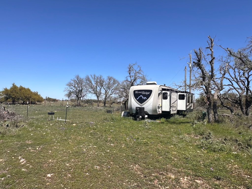 2112 Turkey Ridge Lane Harper, TX 78631 - Photo 5 of 11 a house with trees in the background
