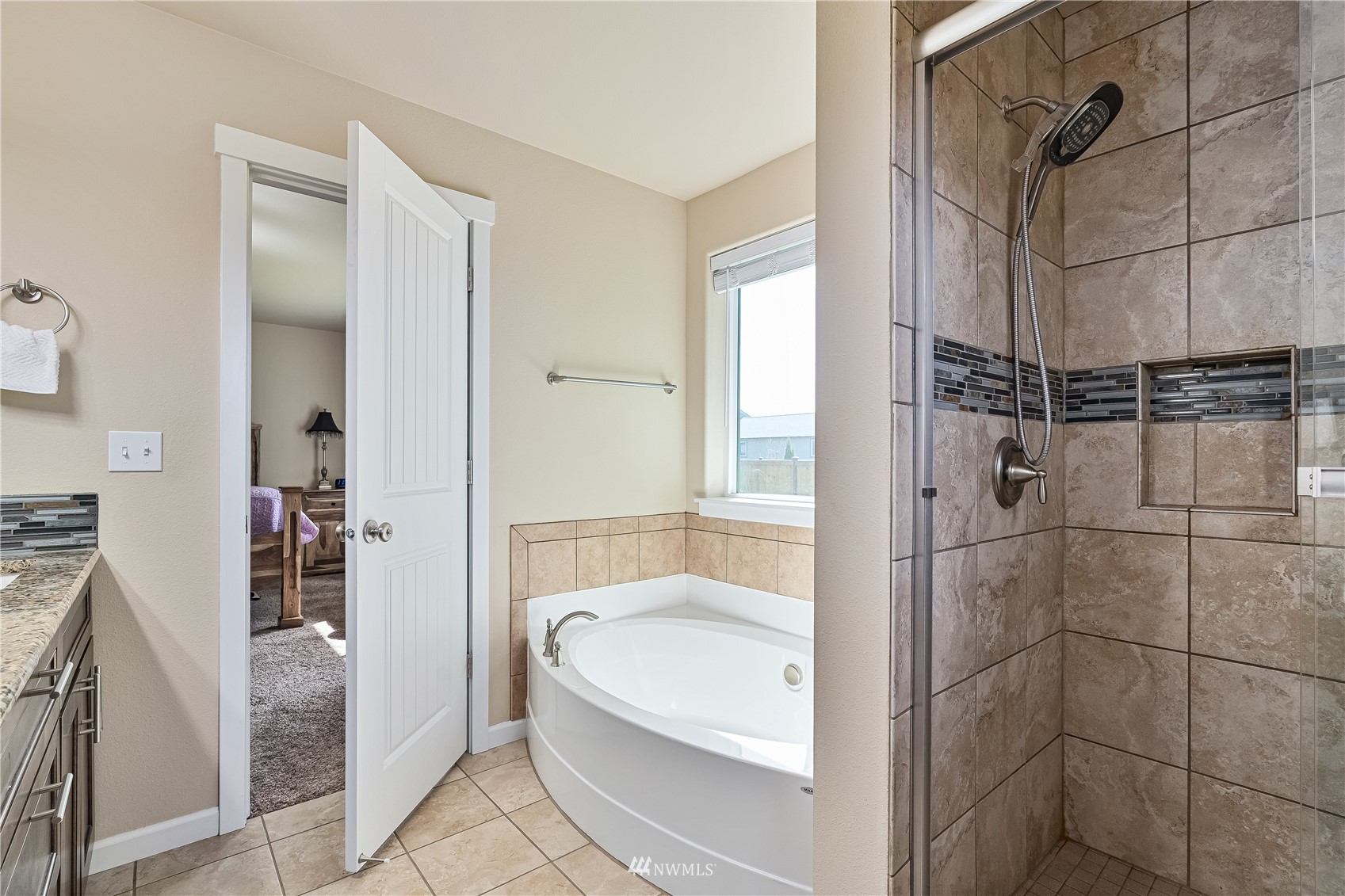 9249 179th Trail Southwest Rochester, WA 98579 - Photo 19 of 40 a bathroom with a tub and shower