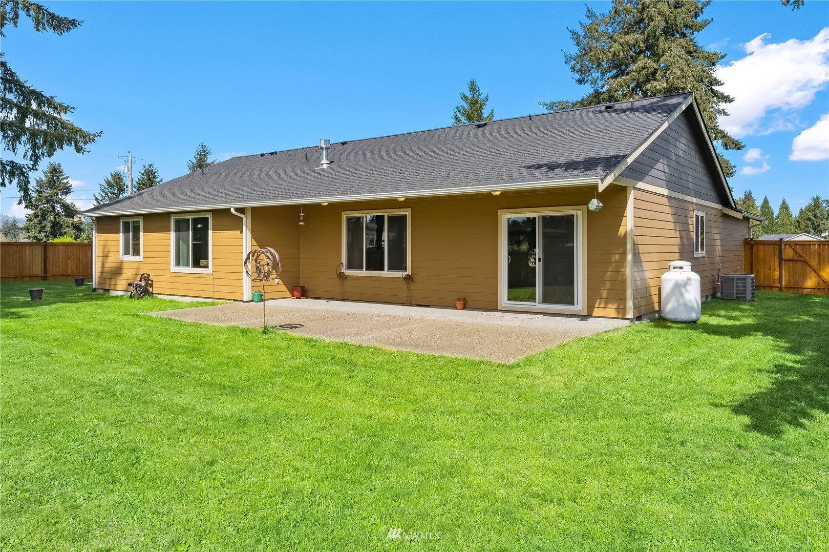9249 179th Trail Southwest Rochester, WA 98579 - Photo 28 of 40 a view of a house with a backyard