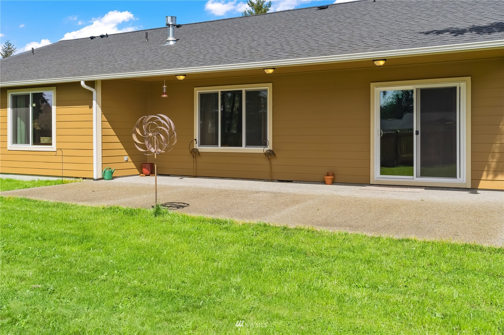 9249 179th Trail Southwest Rochester, WA 98579 - Photo 29 of 40 a front view of a house with garden