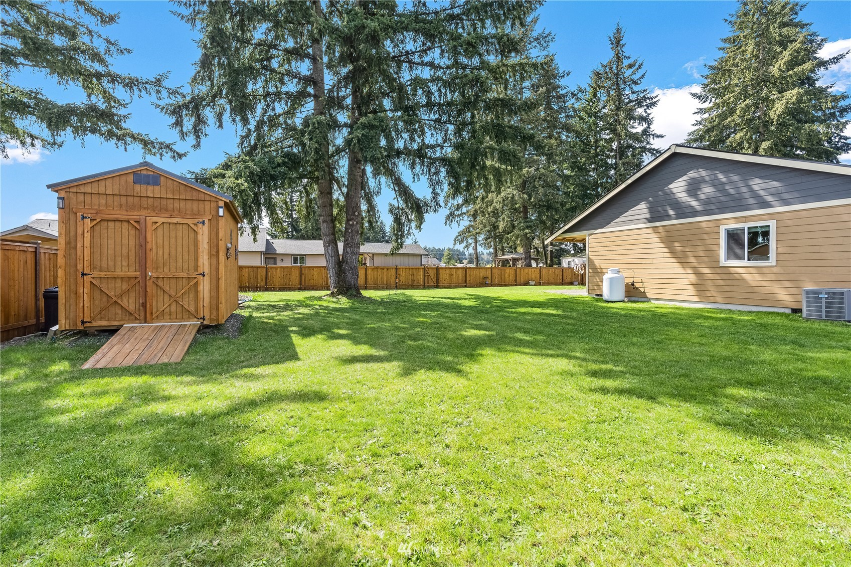 9249 179th Trail Southwest Rochester, WA 98579 - Photo 31 of 40 a view of a house with a yard
