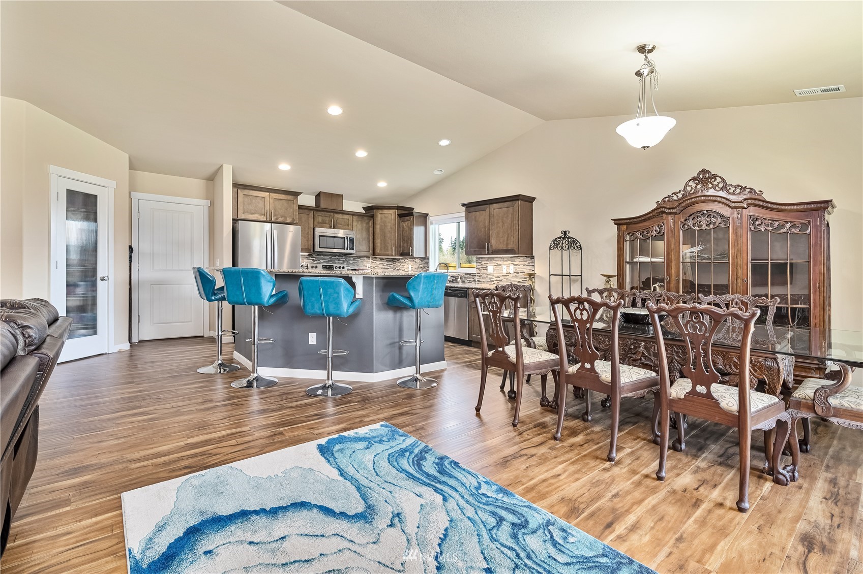 9249 179th Trail Southwest Rochester, WA 98579 - Photo 8 of 40 a living room with lots of furniture and kitchen view