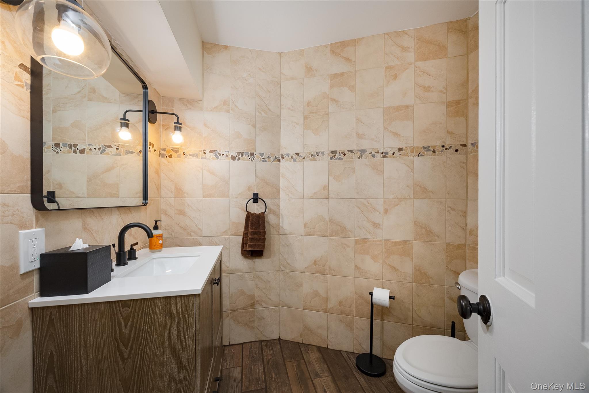 10 Quail Ridge Road Hyde Park, NY 12538 - Photo 20 of 40 a bathroom with a sink vanity mirror and toilet