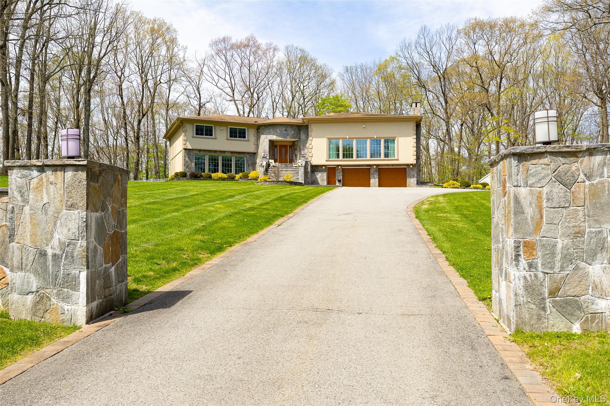 10 Quail Ridge Road Hyde Park, NY 12538 - Photo 2 of 40 a front view of a house with a garden and trees