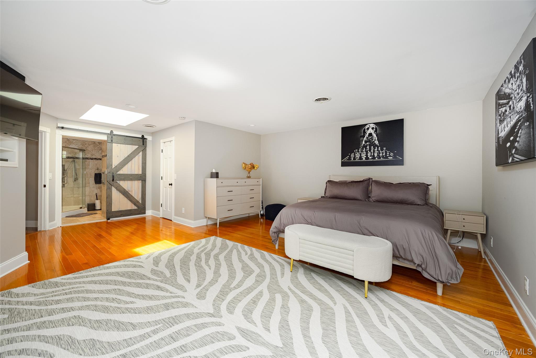10 Quail Ridge Road Hyde Park, NY 12538 - Photo 26 of 40 a bedroom with two beds and a chandelier