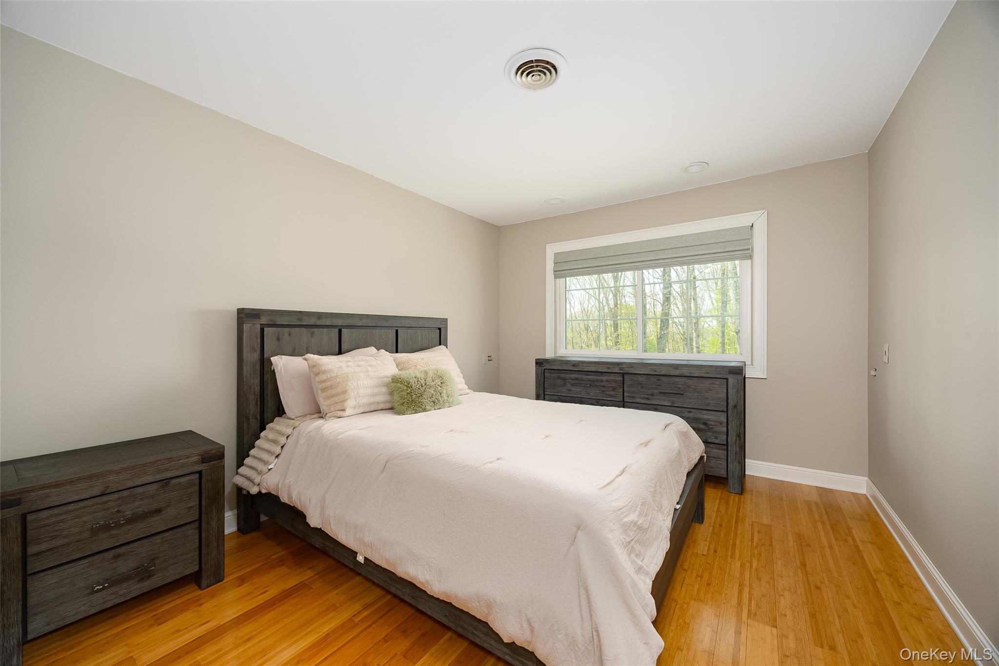 10 Quail Ridge Road Hyde Park, NY 12538 - Photo 29 of 40 a bedroom with a bed and wooden floor