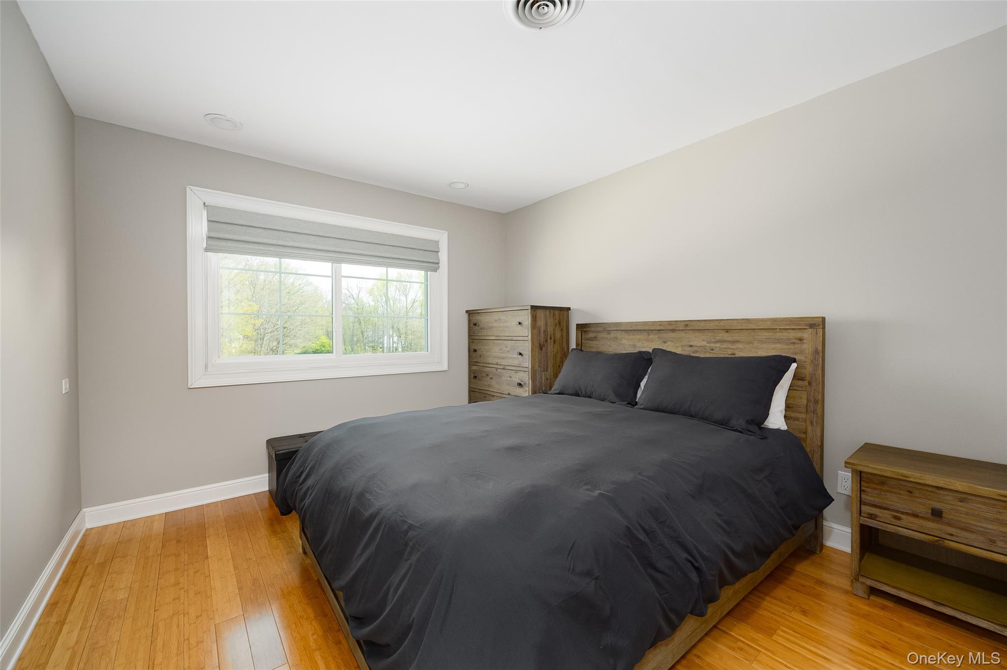 10 Quail Ridge Road Hyde Park, NY 12538 - Photo 30 of 40 a bedroom with a bed and wooden floor