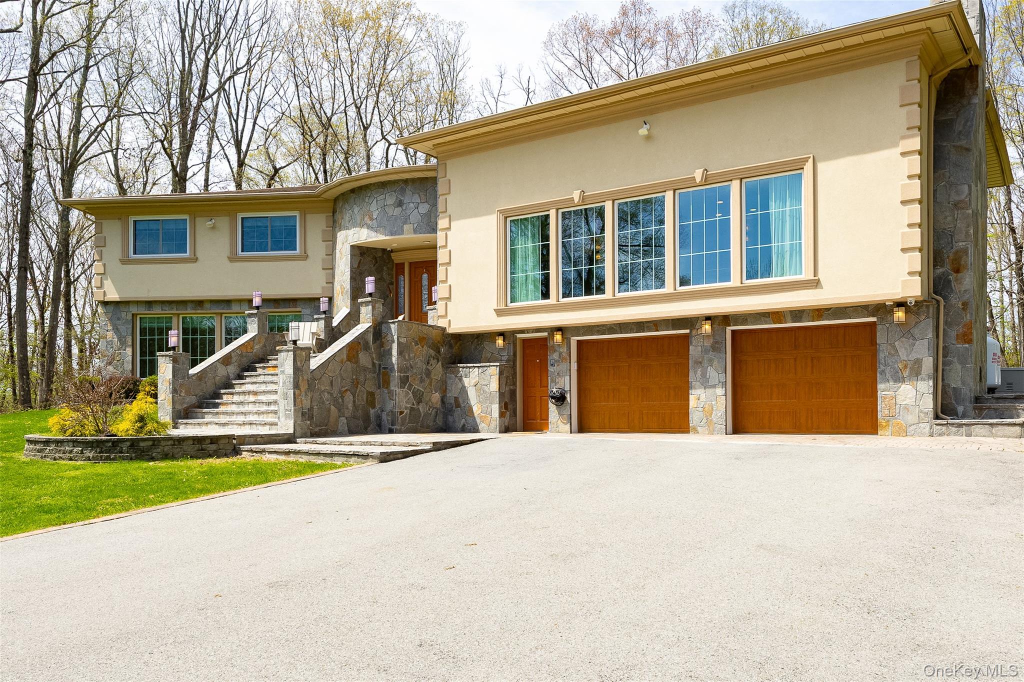 10 Quail Ridge Road Hyde Park, NY 12538 - Photo 3 of 40 a front view of a house with a yard and garage
