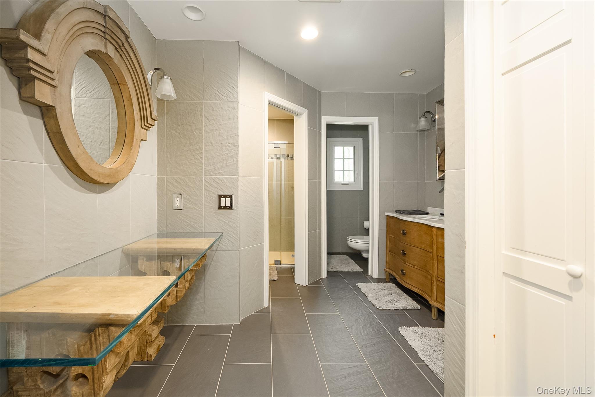 10 Quail Ridge Road Hyde Park, NY 12538 - Photo 31 of 40 a bathroom with a sink a toilet and a mirror